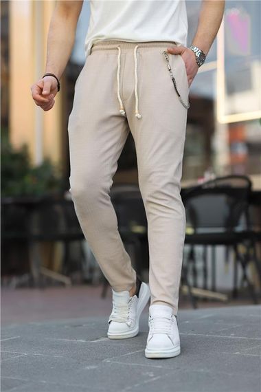 Трикотажні штани з візерунком на ланцюжку з еластичною талією - бежеві - фото 1