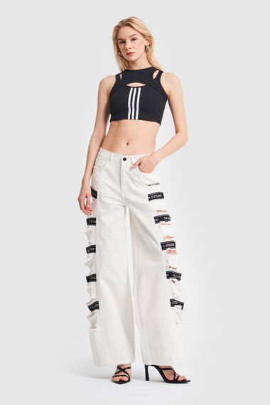 Жіноча джинсова тканина кольору екрю з рваною стороною та детальним дизайном - фото 2