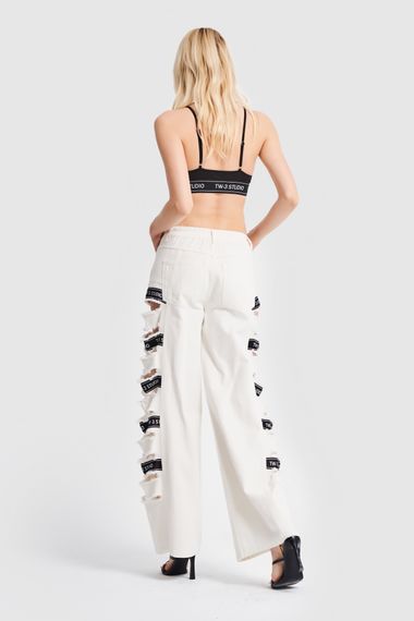 Жіноча джинсова тканина кольору екрю з рваною стороною та детальним дизайном - фото 5